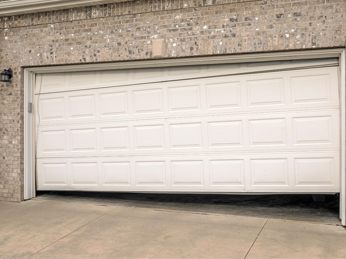 A garage door that has a problem, needing service.