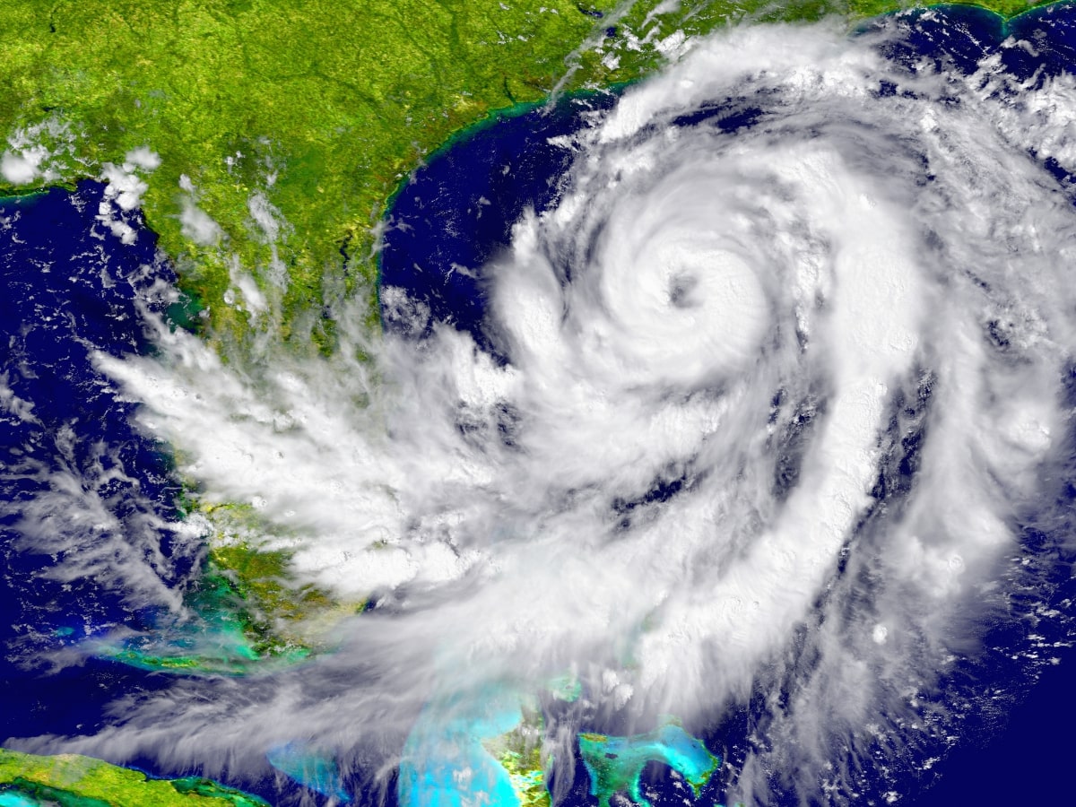 An aerial shot of a massive storm, showing its swirling clouds.