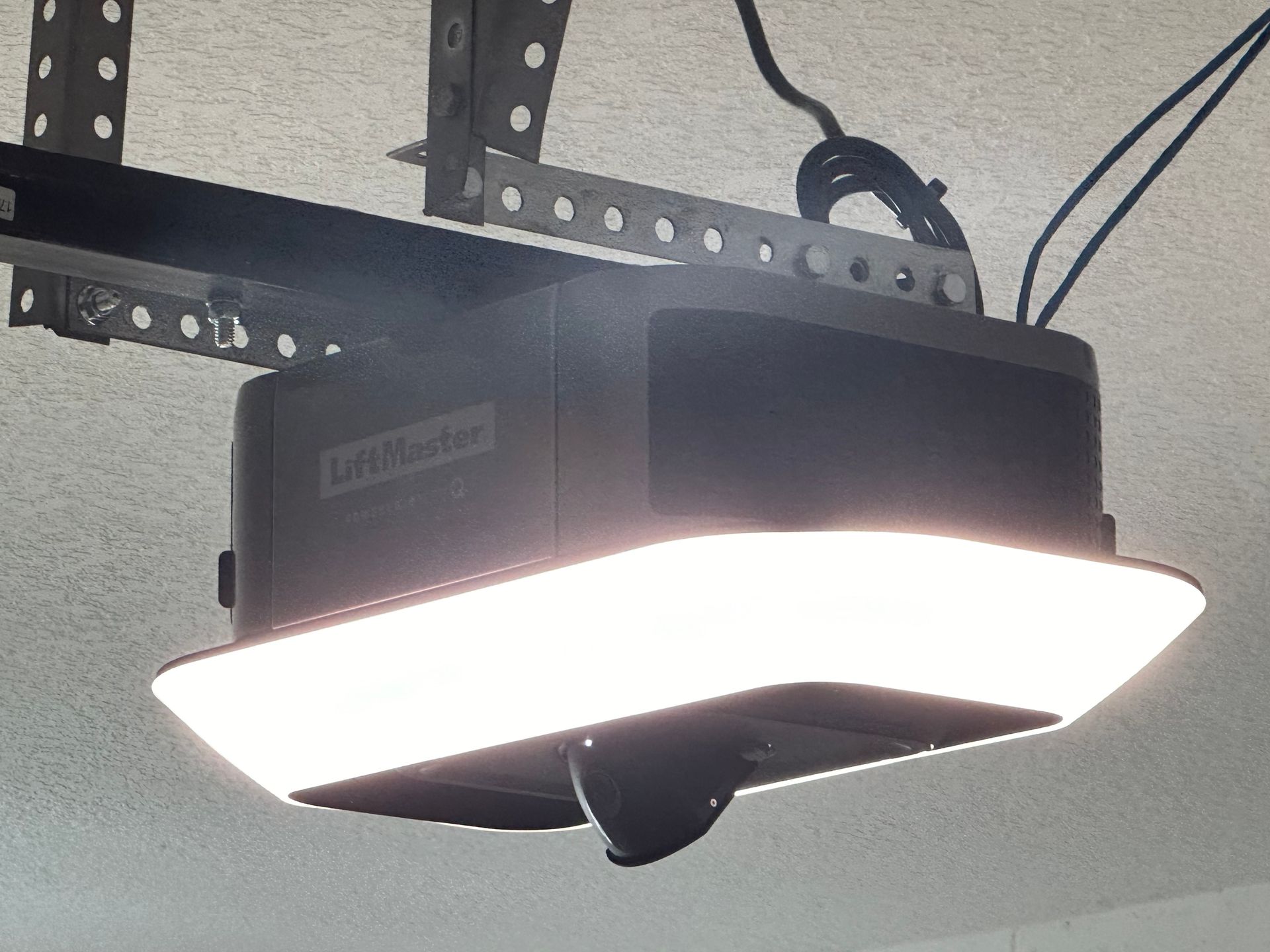 A garage door that has a problem, needing service.